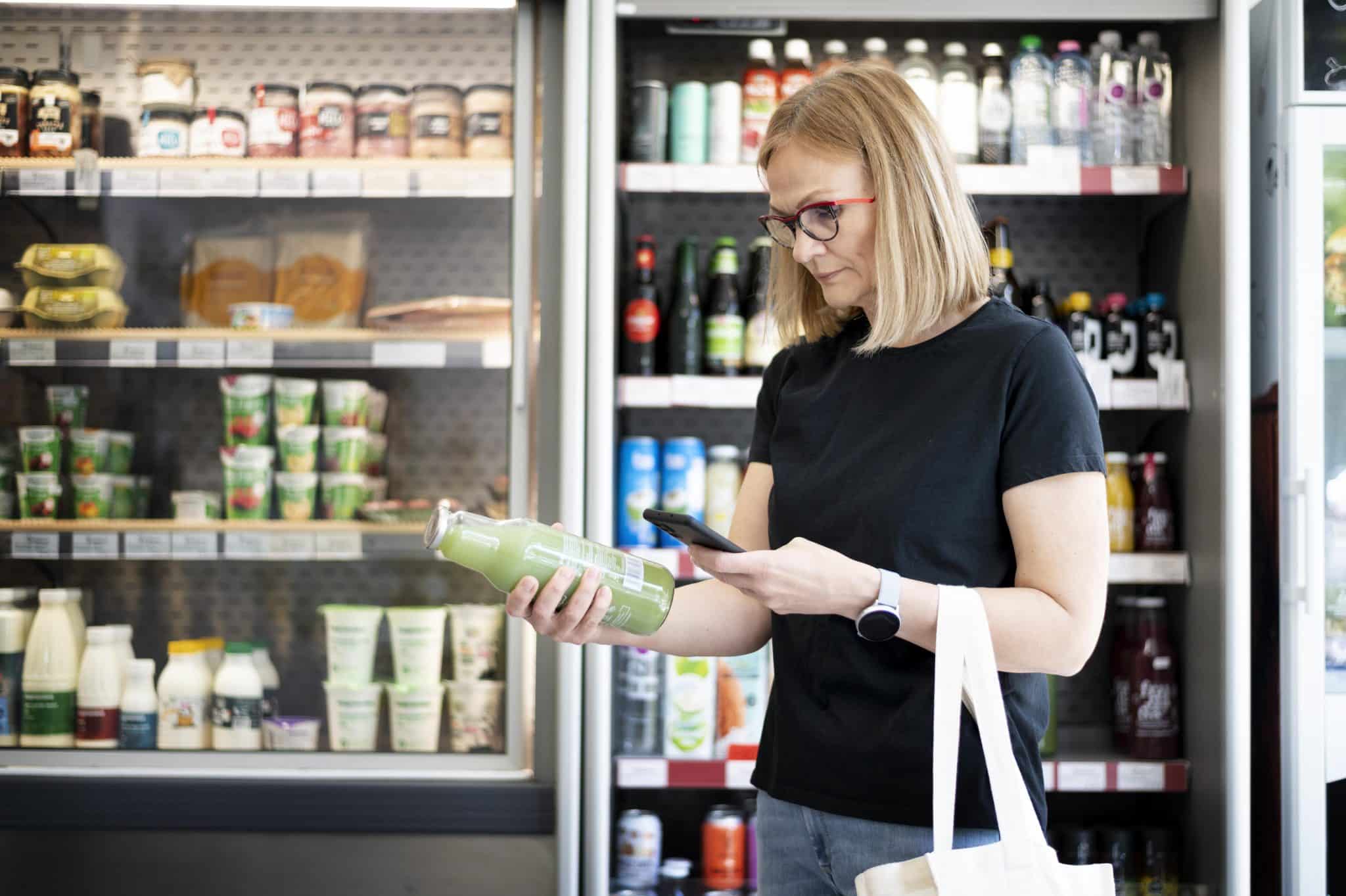 Woman shopping for better-for-you beverage